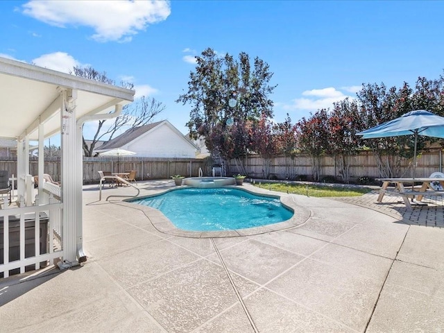 view of swimming pool with a patio area, a fenced backyard, and an in ground hot tub