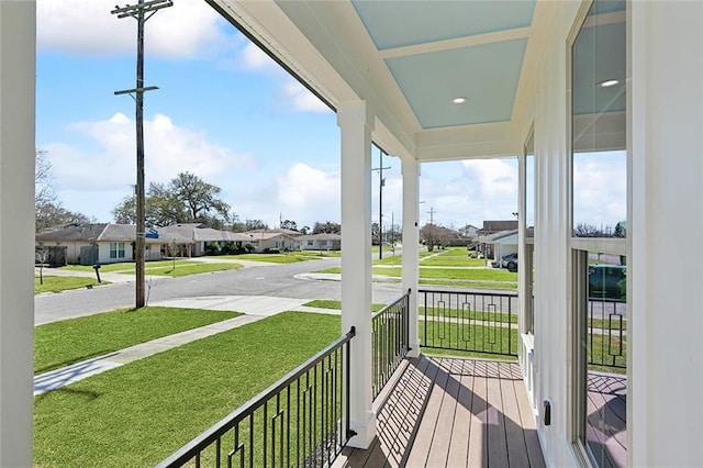 balcony featuring a residential view and a porch