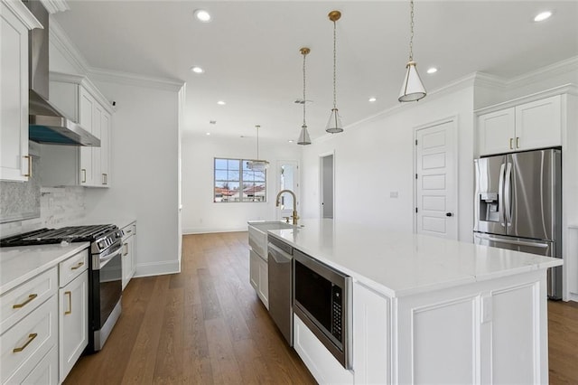 kitchen with stainless steel appliances, crown molding, wall chimney range hood, and tasteful backsplash