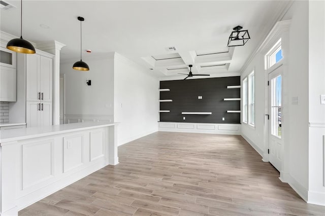 empty room featuring crown molding, visible vents, ceiling fan, and light wood finished floors