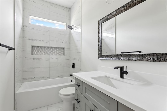 bathroom with toilet, marble finish floor,  shower combination, and vanity