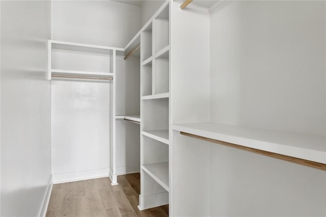 spacious closet with wood finished floors