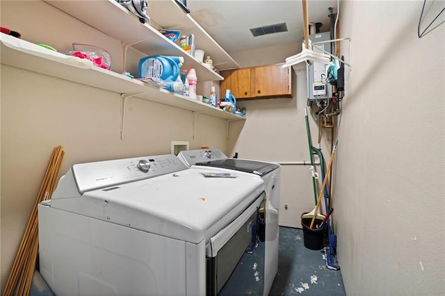 clothes washing area with washer and dryer, laundry area, and visible vents