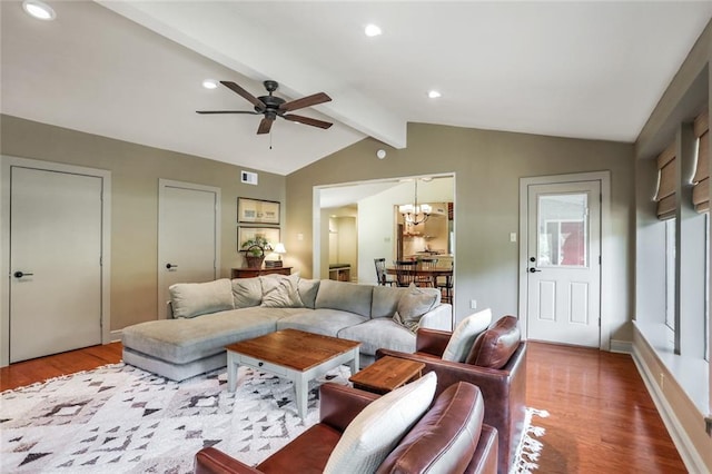 living area featuring vaulted ceiling with beams, visible vents, wood finished floors, and recessed lighting