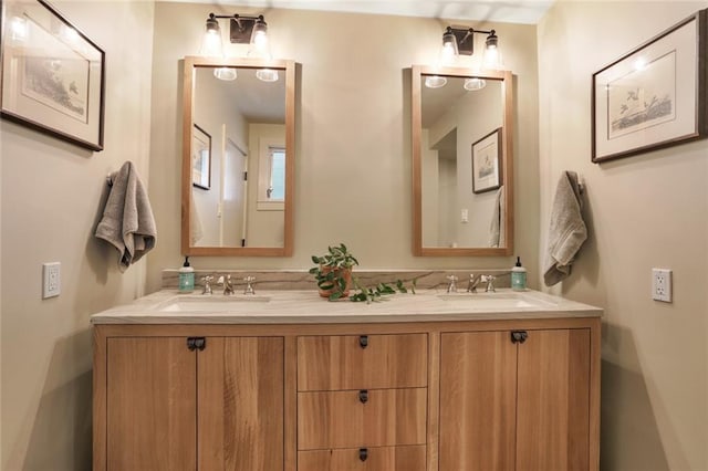 bathroom with a sink and double vanity