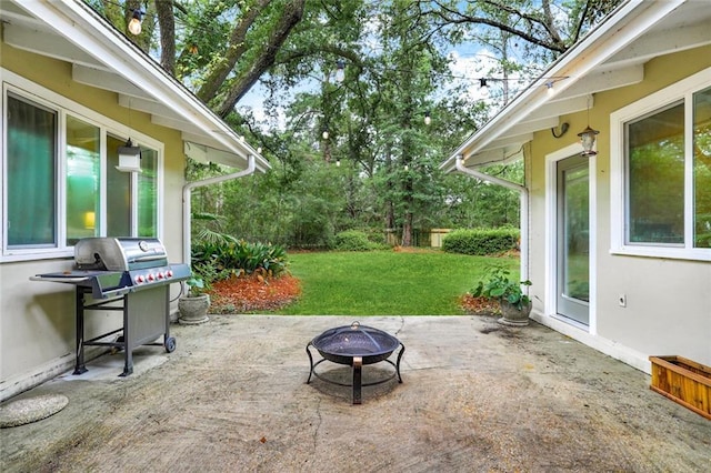 view of patio featuring a fire pit and area for grilling