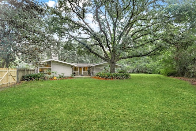 view of yard featuring fence