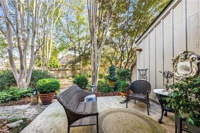 view of patio featuring fence