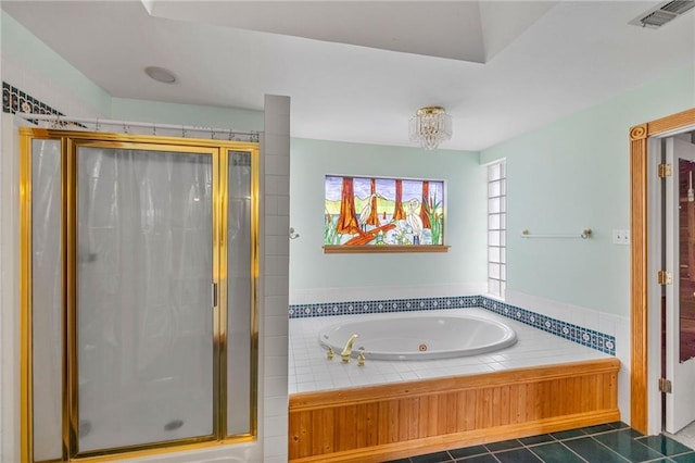 bathroom with tile patterned flooring, visible vents, a stall shower, and a whirlpool tub