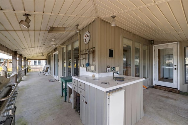 view of patio with a porch and ceiling fan