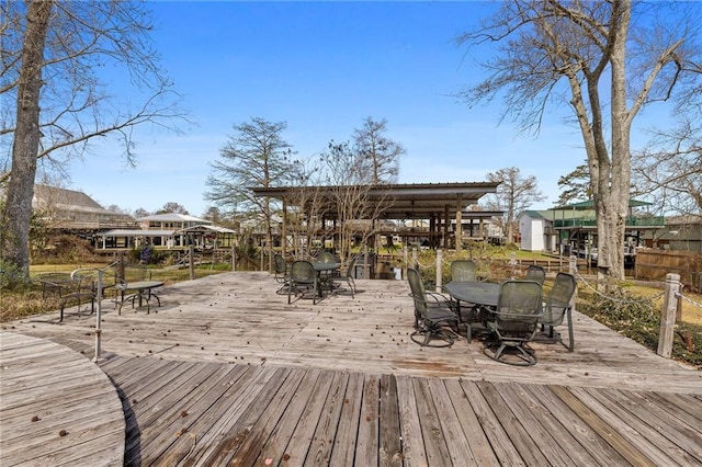 wooden deck with outdoor dining area