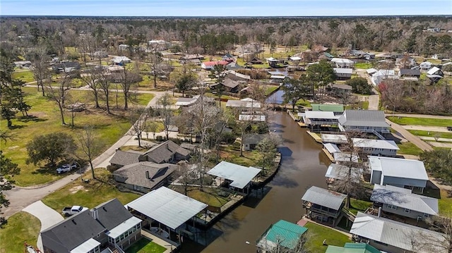 bird's eye view featuring a residential view and a water view