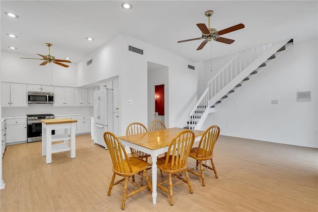 dining area with recessed lighting, visible vents, light wood-style flooring, ceiling fan, and stairs