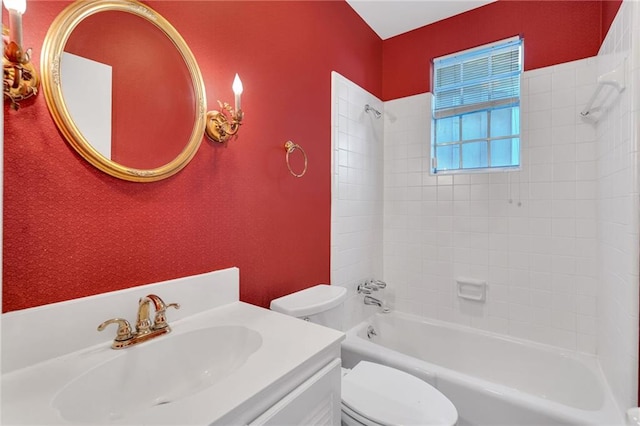 bathroom with toilet, shower / tub combination, and vanity