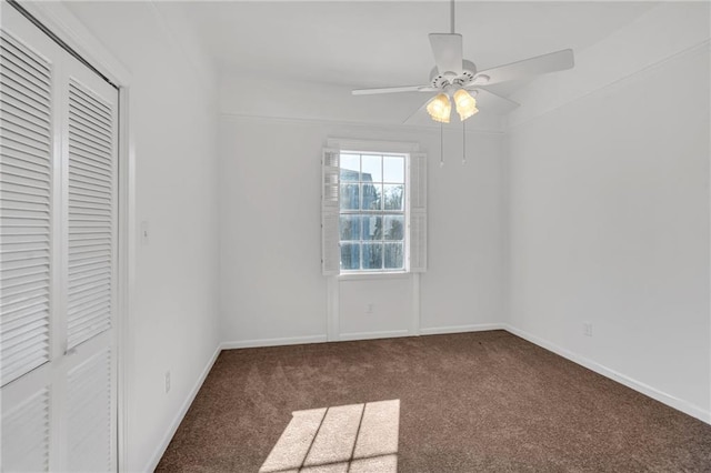 unfurnished bedroom featuring a closet, carpet flooring, ceiling fan, and baseboards