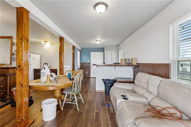 3030 Ridgeway Blvd, New Orleans, LA 70129 - living room featuring a wainscoted wall and dark wood-type flooring