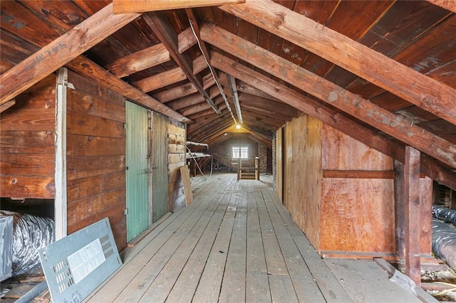 attic featuring an upstairs landing