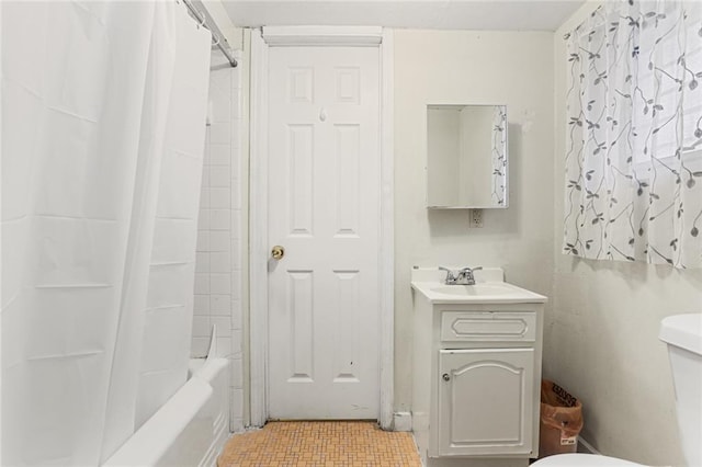 bathroom featuring toilet, shower / bath combination with curtain, and vanity