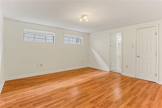 entrance foyer featuring light wood finished floors and baseboards