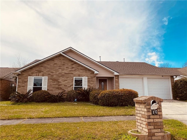 ranch-style home with a shingled roof, a front lawn, concrete driveway, a garage, and brick siding