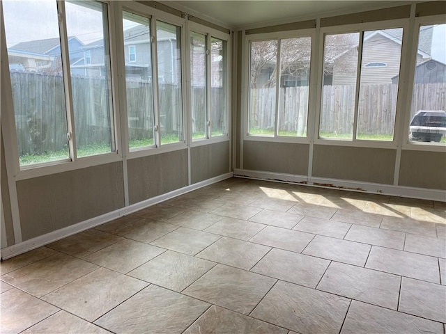 unfurnished sunroom featuring a healthy amount of sunlight