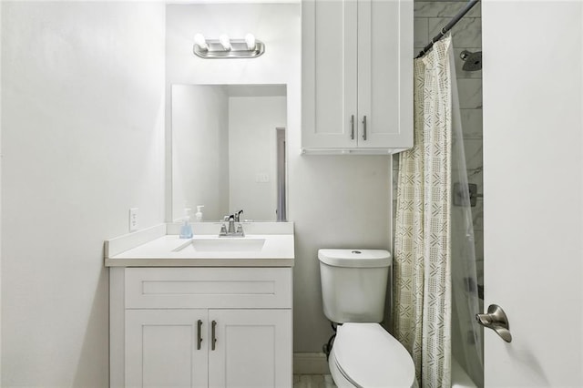 full bath featuring toilet, a shower with curtain, and vanity