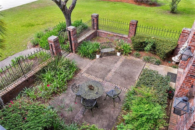 exterior space featuring a yard, a patio, and fence