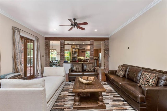 living room with a ceiling fan, recessed lighting, crown molding, and wood finished floors