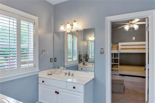 full bathroom with ceiling fan and vanity