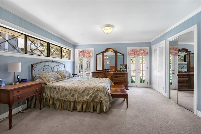 carpeted bedroom with french doors, baseboards, and ornamental molding