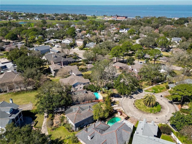 drone / aerial view featuring a residential view and a water view