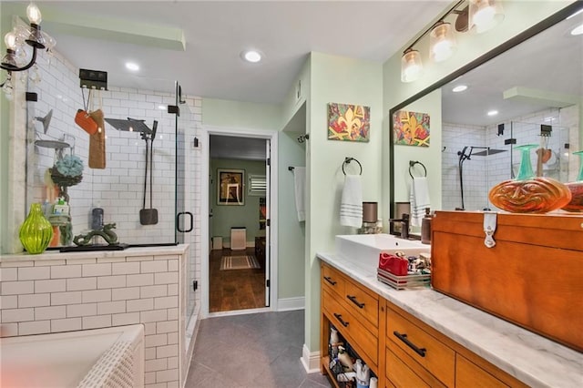 bathroom with tile patterned floors, vanity, a bath, and a shower stall