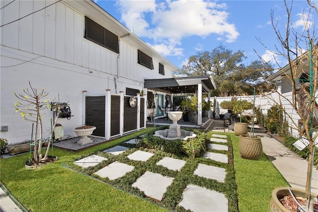 view of yard featuring a fenced backyard, central air condition unit, and a patio