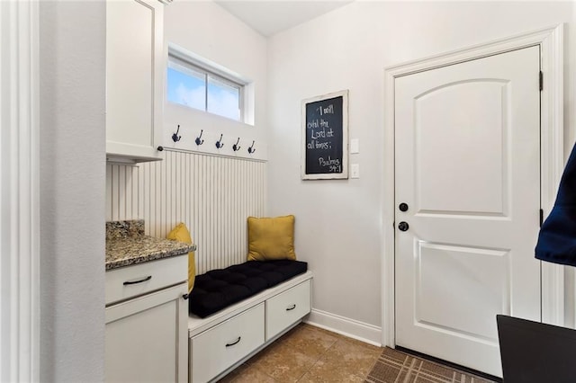 mudroom featuring tile patterned flooring and baseboards