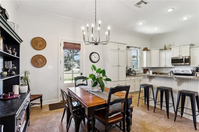 dining area featuring light tile patterned flooring, visible vents, baseboards, and ornamental molding