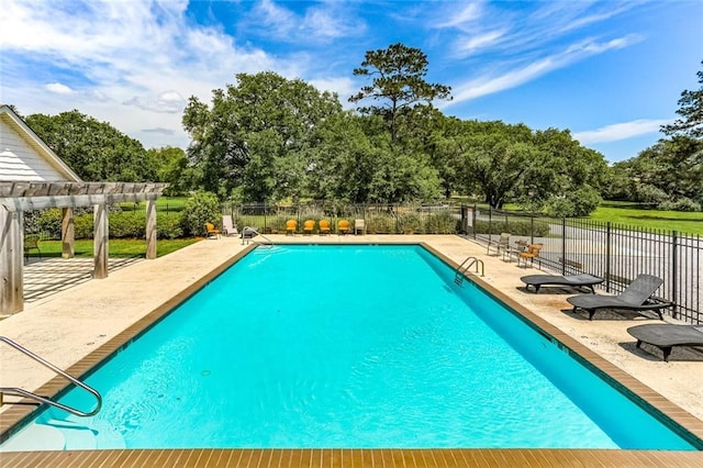 pool featuring a patio, fence, and a pergola