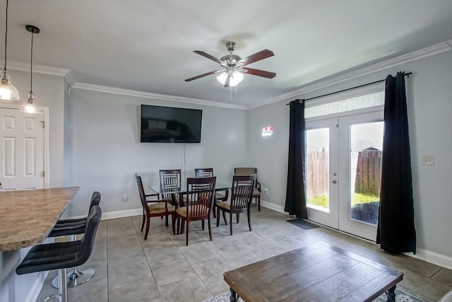 dining room featuring crown molding, light tile patterned floors, french doors, and baseboards