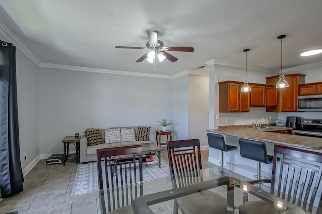 interior space with crown molding, light tile patterned flooring, a ceiling fan, and baseboards