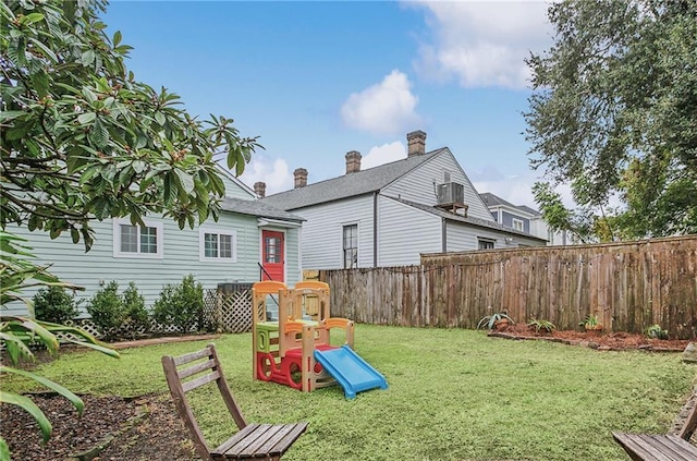 view of jungle gym featuring a yard and fence