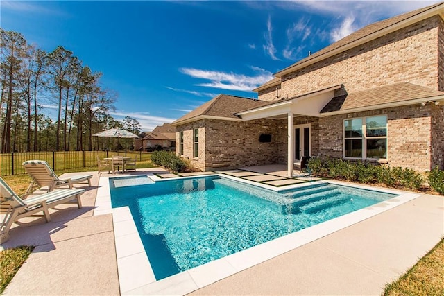 view of pool with french doors, fence, a fenced in pool, and a patio area