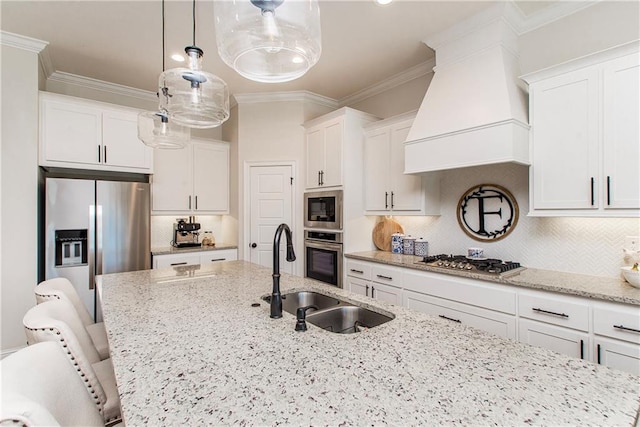 kitchen featuring tasteful backsplash, crown molding, premium range hood, appliances with stainless steel finishes, and a sink