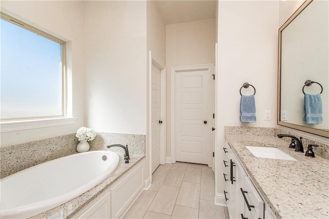 full bath featuring vanity and a garden tub