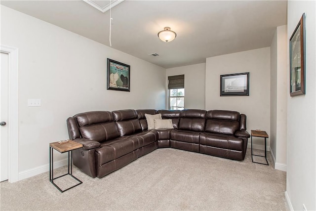 living room featuring attic access, carpet flooring, baseboards, and visible vents