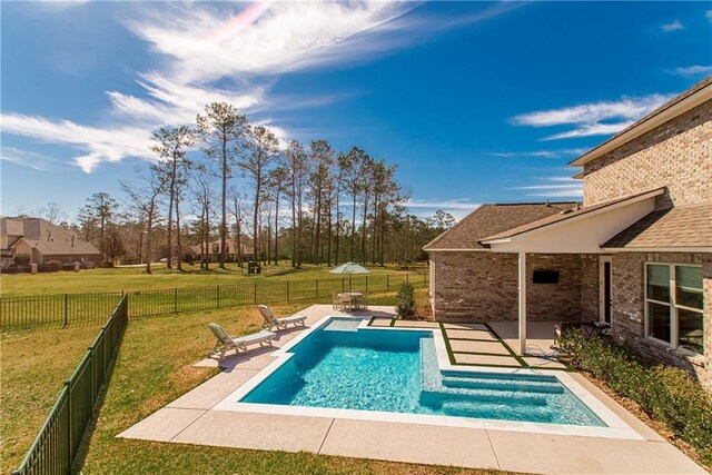 view of pool with a patio, a yard, a fenced backyard, and a fenced in pool