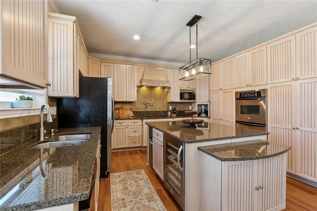 kitchen with a kitchen island, wine cooler, dark wood-style floors, black appliances, and a sink