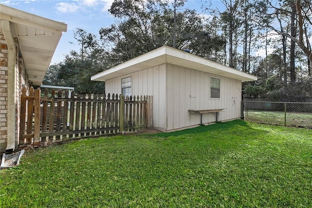 view of outbuilding featuring fence