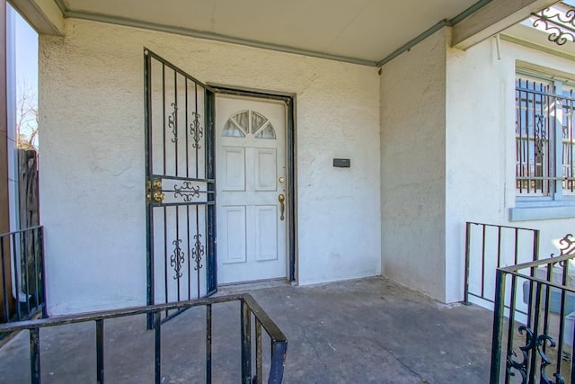 doorway to property with stucco siding