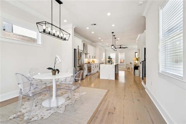 dining area featuring recessed lighting, light wood-type flooring, baseboards, and visible vents