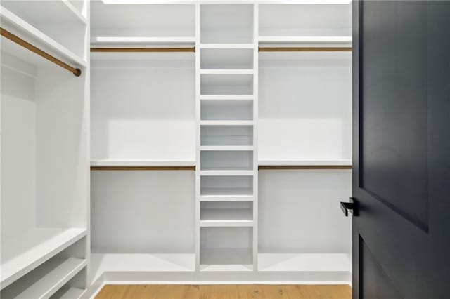 spacious closet with wood finished floors