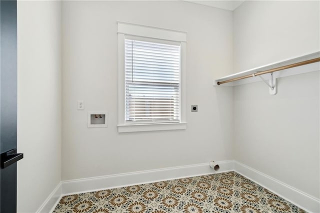 clothes washing area featuring laundry area, hookup for a washing machine, hookup for an electric dryer, and baseboards